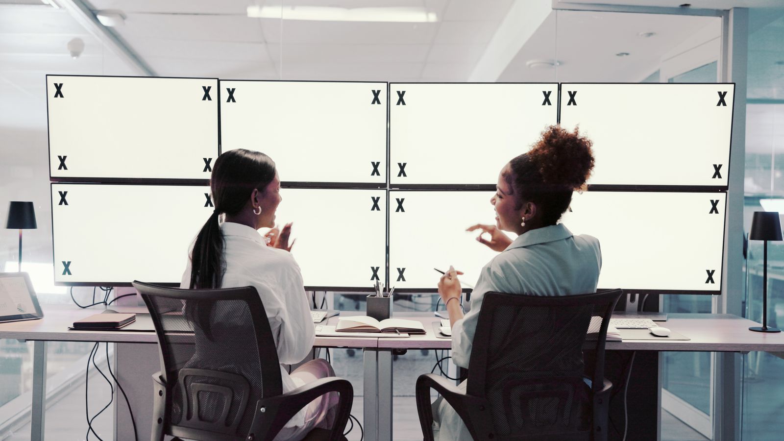 Engineering workspace with multiple monitors showing video stream diagnostics