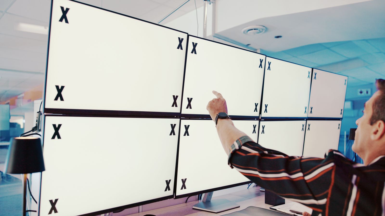 Device test lab with multiple smart TVs and streaming devices arranged for cross-platform QA