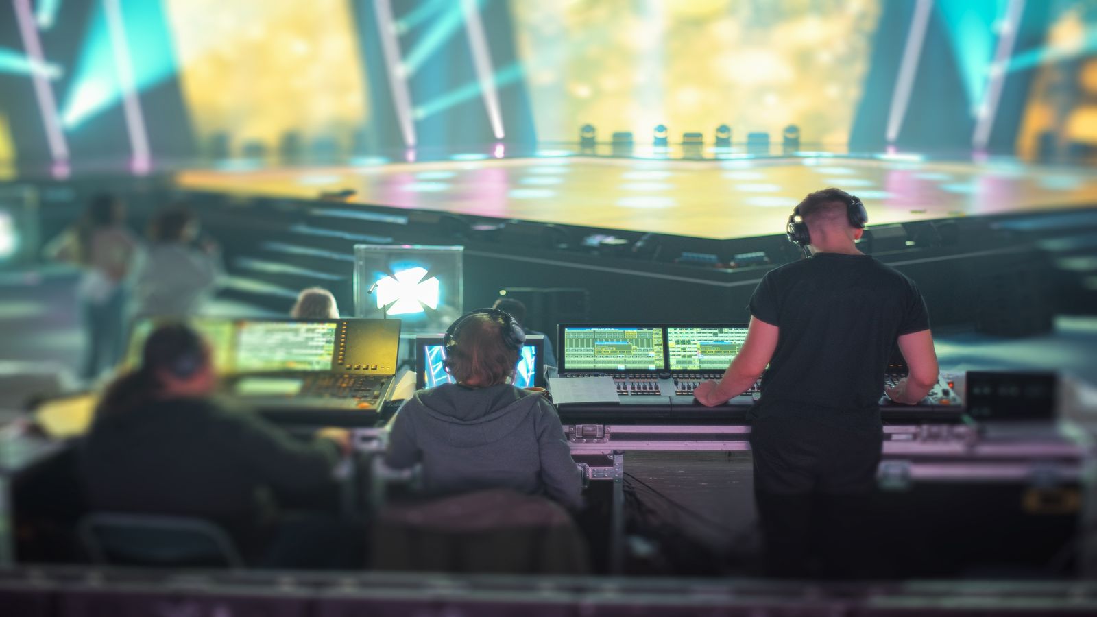 Sports broadcast control room with multi-screen monitoring wall showing live stream feeds